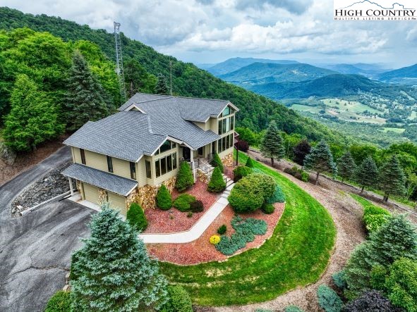 a beautiful mountain home on a hill