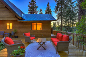 the porch outside a Beech Mountain house for sale, pictured at twilight as the horizon dims in the background